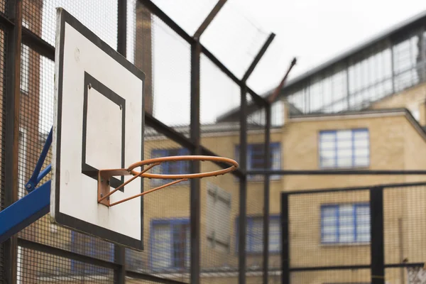 Basketball hoop and backboard within a housing estate