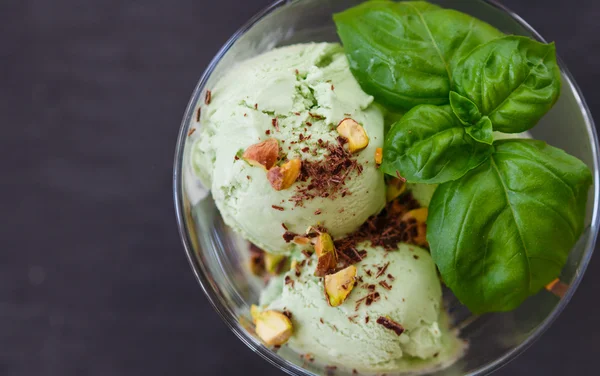 Homemade organic green ice cream - Basil, pistachio, green tea, mint. A refreshing summer dessert. Selective focus