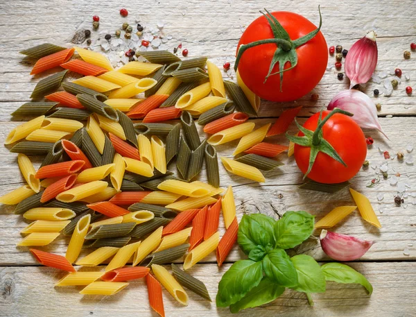 Colorful Italian raw pasta. Pasta penne rigate tricolor