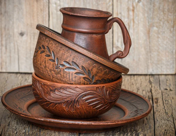 A set of homemade brown pottery for kitchen. Brown clay. Utensils