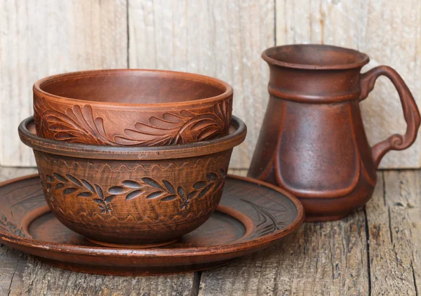 A set of homemade brown pottery for kitchen. Brown clay. Utensils