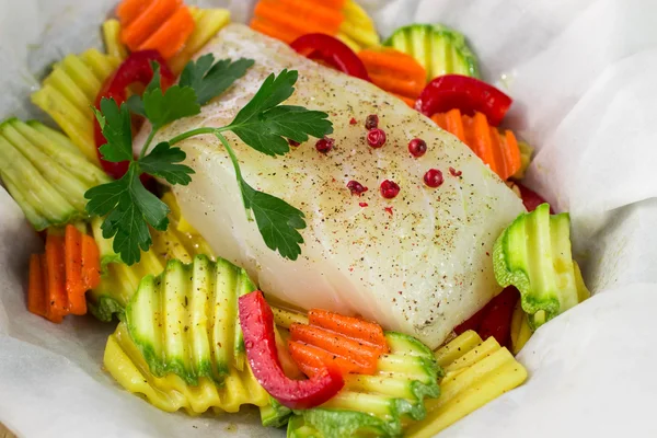 Cooking fish with vegetables in parchment. Healthy eating, diet