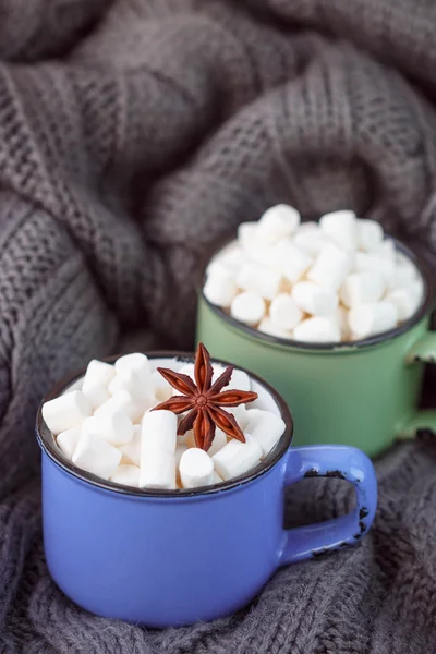 Two cups of cocoa with marshmallows