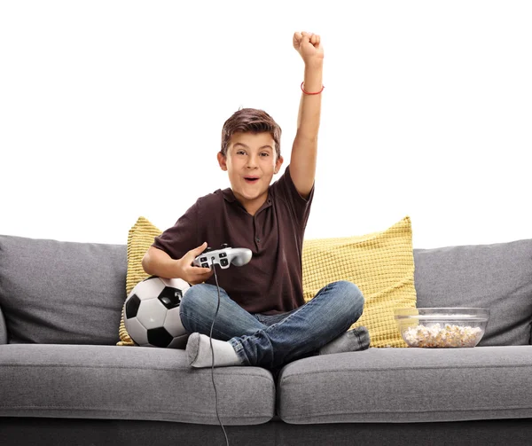 Joyful kid playing video game