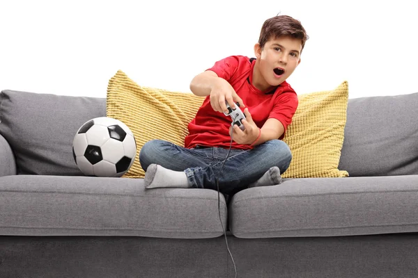 Boy playing football video game