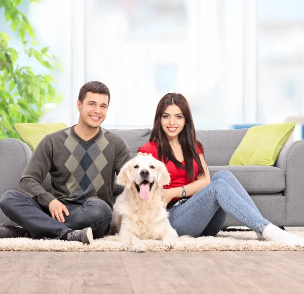 Couple on floor with dog