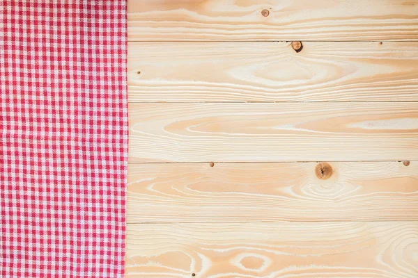 Wood texture with red squared textile napkin