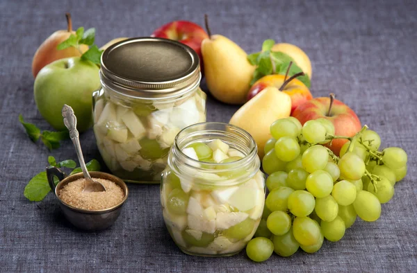 Apples pears grapes in a sugar syrup