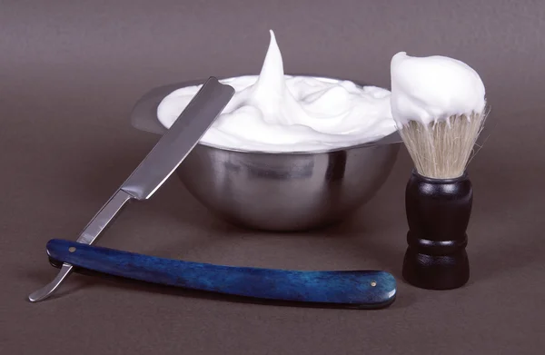 A complete shaving-set: razor, shaving brush and a bowl for shav