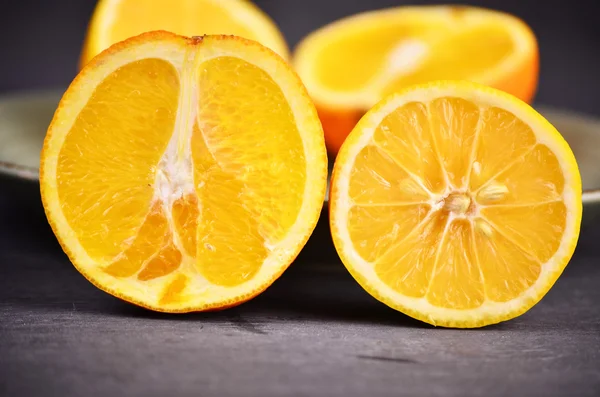 Fresh lemon and orange isolated on white