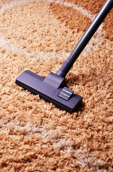 Vacuum cleaner on the carpet. Modern living room, with a vacuum cleaner to tidy up
