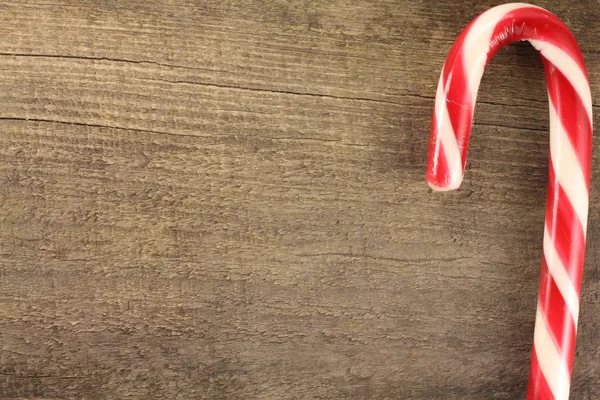 Candy Cane on the background of wood