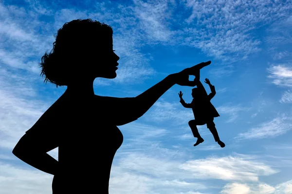 Silhouette feminist holding a small man.