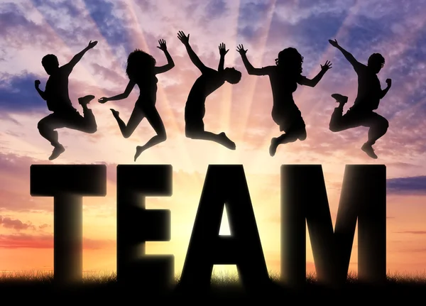 Silhouette people jumping over the word team