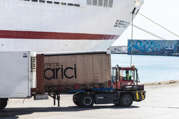 Truck moving a container