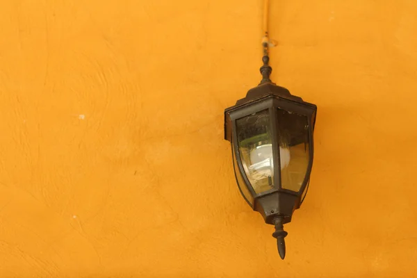 Lamp wall on light brown background.