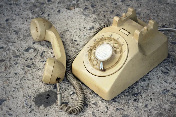 Brown old phone vintage style on a floor.
