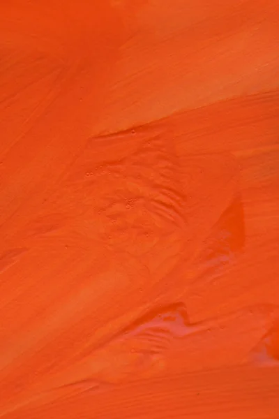 Orange paint brush strokes on the surface