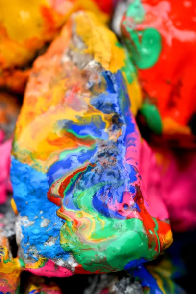 Rocks covered with colorful paint close-up