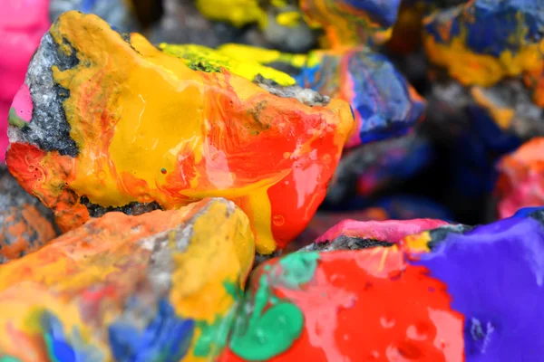 Rocks covered with colorful paint close-up