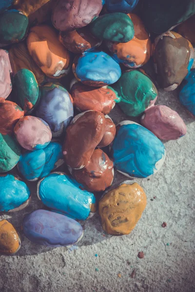 Colored stones lying on a flat surface