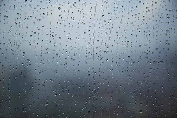 Art pattern of water drop on tower window after rain, for background.