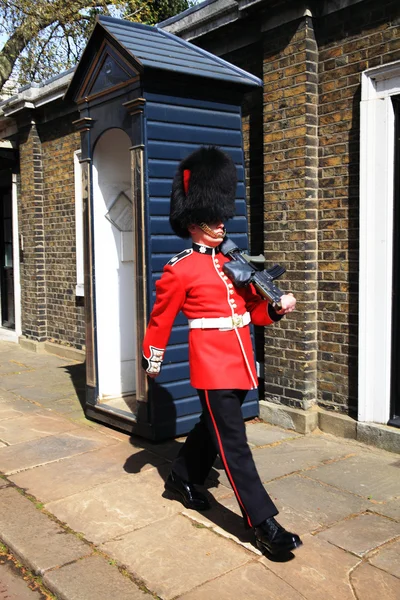 Coldstream Guard marching near his sentry box
