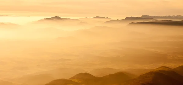 Yellow foggy mountain landscape