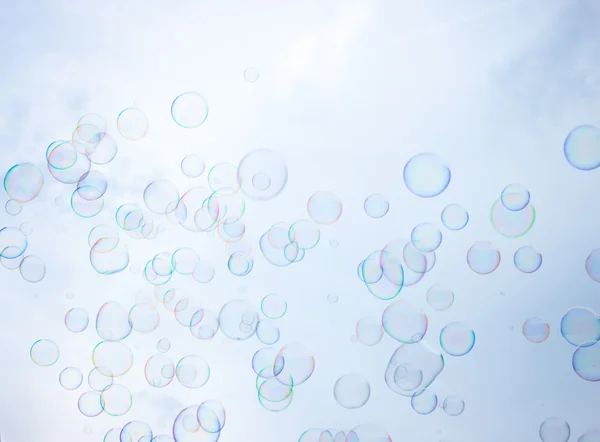 Soap bubbles on sky background