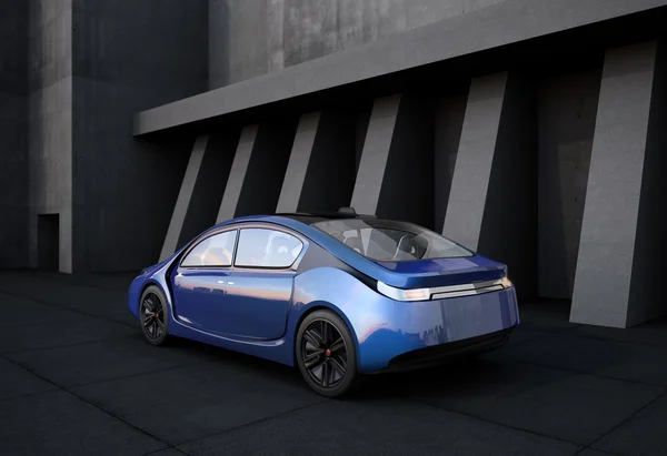 Rear view of blue electric car in front of concrete building.