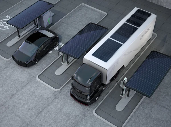 Hybrid electric truck and white electric car in charging station