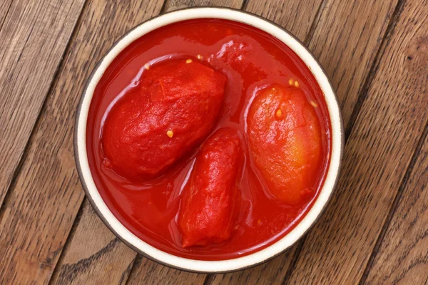 Whole canned tomatoes in juice.