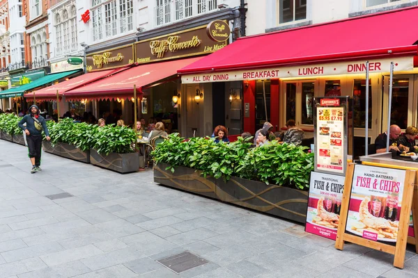 Irving street with restaurants in London, UK