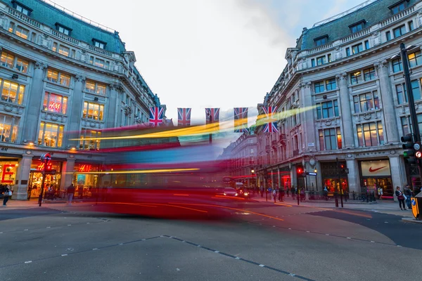 Traffic at Oxford Circus in London, UK, at dusk