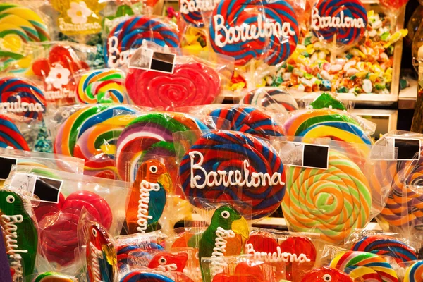 Market stall with candies in the market hall La Boqueria in Barcelona, Spain