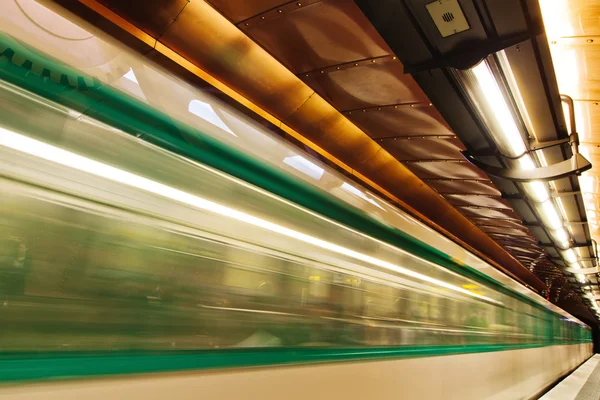 Metro in motion blur at the Arts et Metiers Metro station in Paris, France
