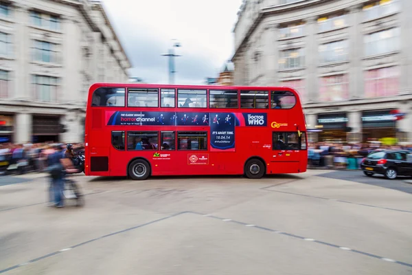 Red London bus in motion blur
