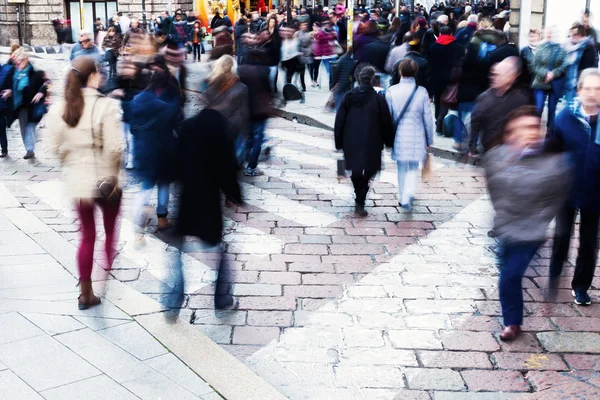 Crowds of people in motion blur in the city