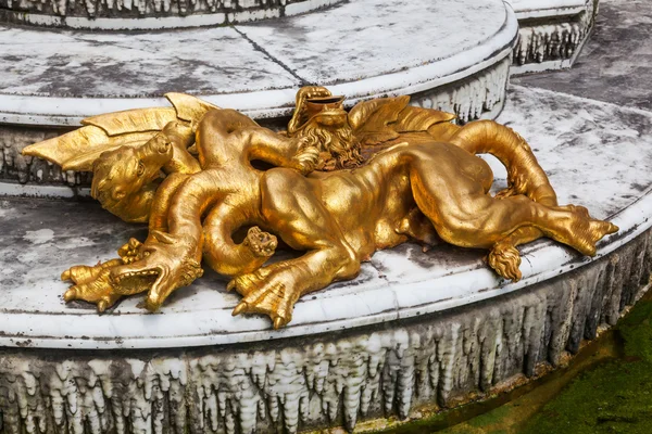 Golden sculptures in the gardens of the Palace of Versailles