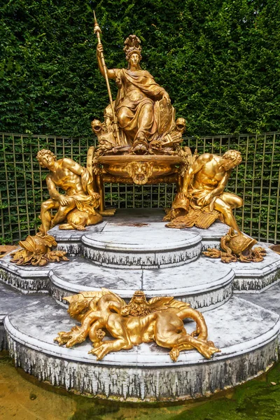 Golden sculptures in the gardens of the Palace of Versailles