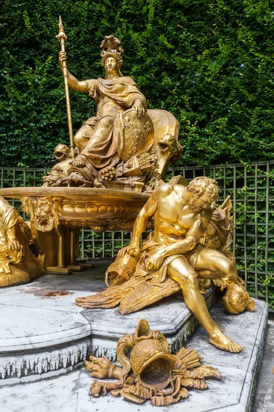 Golden sculptures in the gardens of the Palace of Versailles