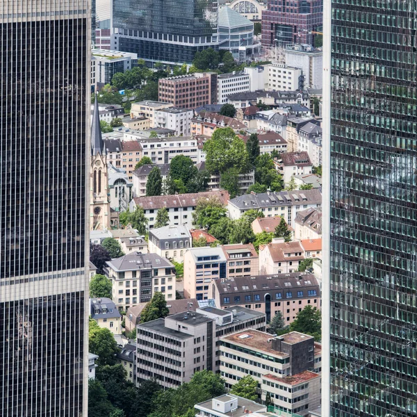 Old city buildings in an aerial view between two skyscrapers in Frankfurt am Main, Germany