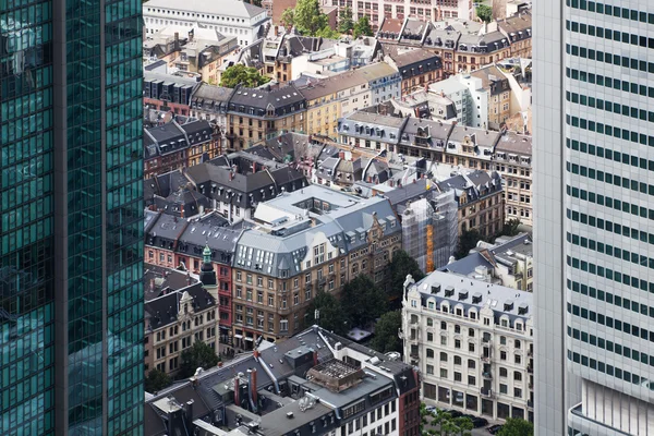 Old city buildings in an aerial view between two skyscrapers in Frankfurt am Main, Germany