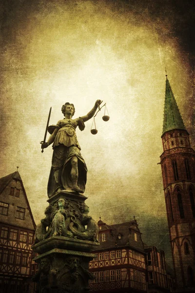 Vintage style picture of the Justitia statue in the old town of Frankfurt am Main, Germany