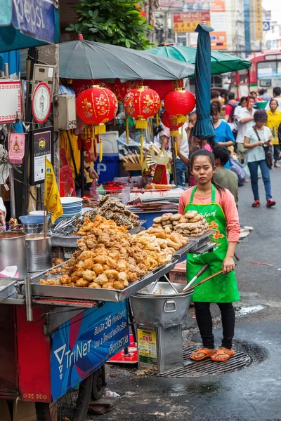 Street scene with a roadside cook shop in Chinatown, Bangkok