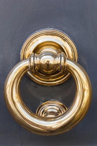 Old golden door knocker