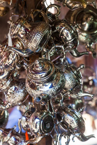 Silverware at a market stall in the souks of Marrakesh, Morocco