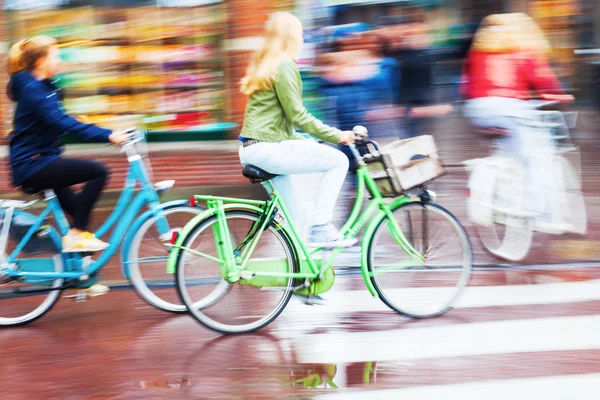 Bicycle rider in the rainy city