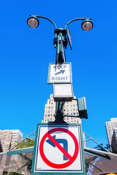 Street lamp and street signs in NYC