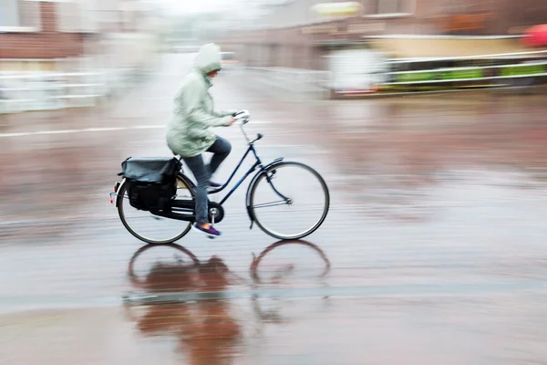 Bicycle rider in the rain